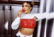 Karol G enseña sus nuevos y sensuales piercings con una ajustada blusa colmbia