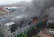 Cuatro desaparecidos y cuatro heridos tras incendio en depósito en Lima