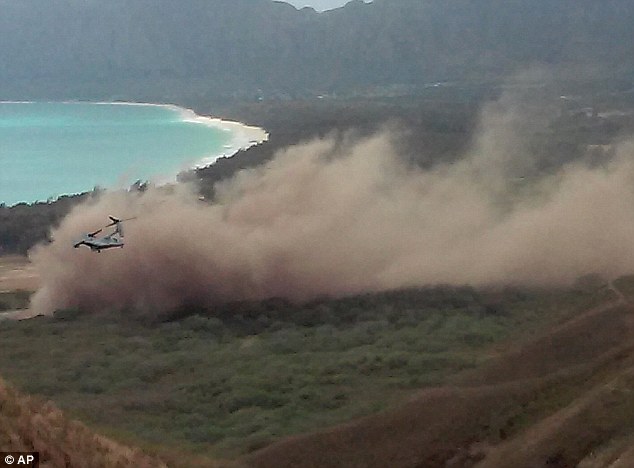 28CD894600000578-3085795-Rising_debris_One_of_three_V_22_Ospreys_that_were_apparently_par-m-92_1431919735621