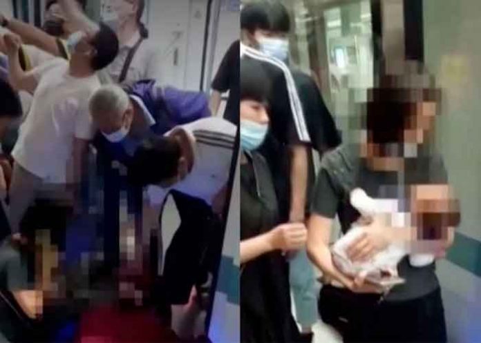 China, Wuhan, vías de metro, bebé