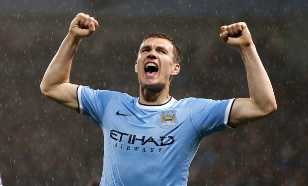 Manchester City's Dzeko celebrates after scoring a goal against Aston Villa during their English Premier League soccer match at the Etihad Stadium in Manchester
