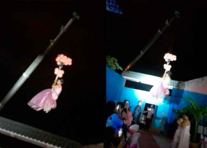 quinceanera ¡Nueva moda! Quinceañera llega a su fiesta de XV años colgada de una grúa