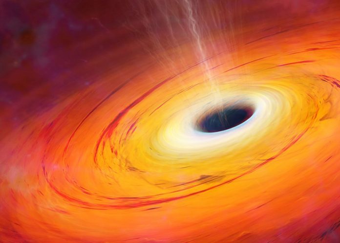 Descubren agujero negro supermasivo que come una tierra por segundo