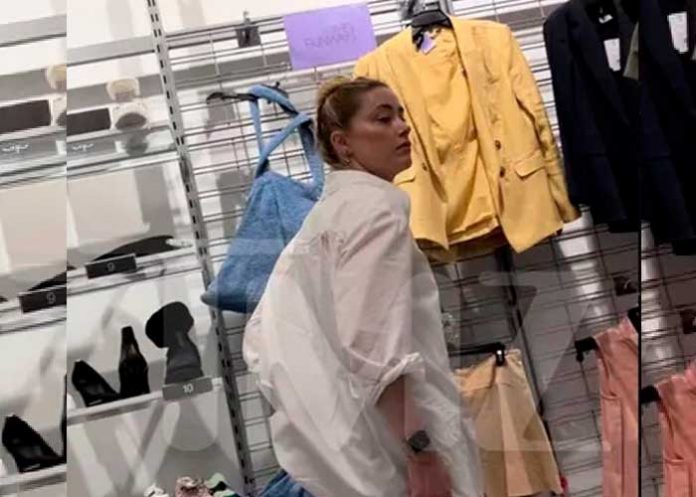 Captan a Amber Heard comprando ropa en tienda de bajo costo