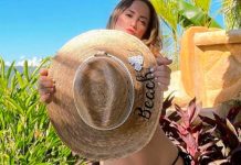 Andrea lució sentada en piedras mientras tomaba el sol
