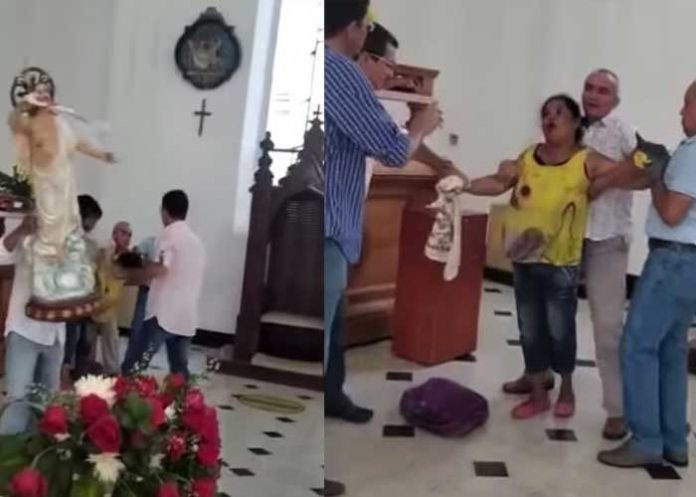 Mujer poseída entra a una iglesia para destruir la imagen del Divino Niño