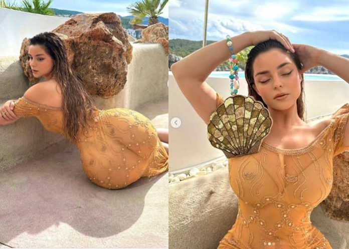 Demi Rose sorprende al posar con un vestido