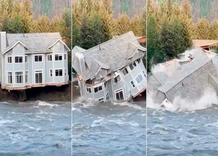 Una casa se desploma sobre un río en medio de las inundaciones en EE.UU